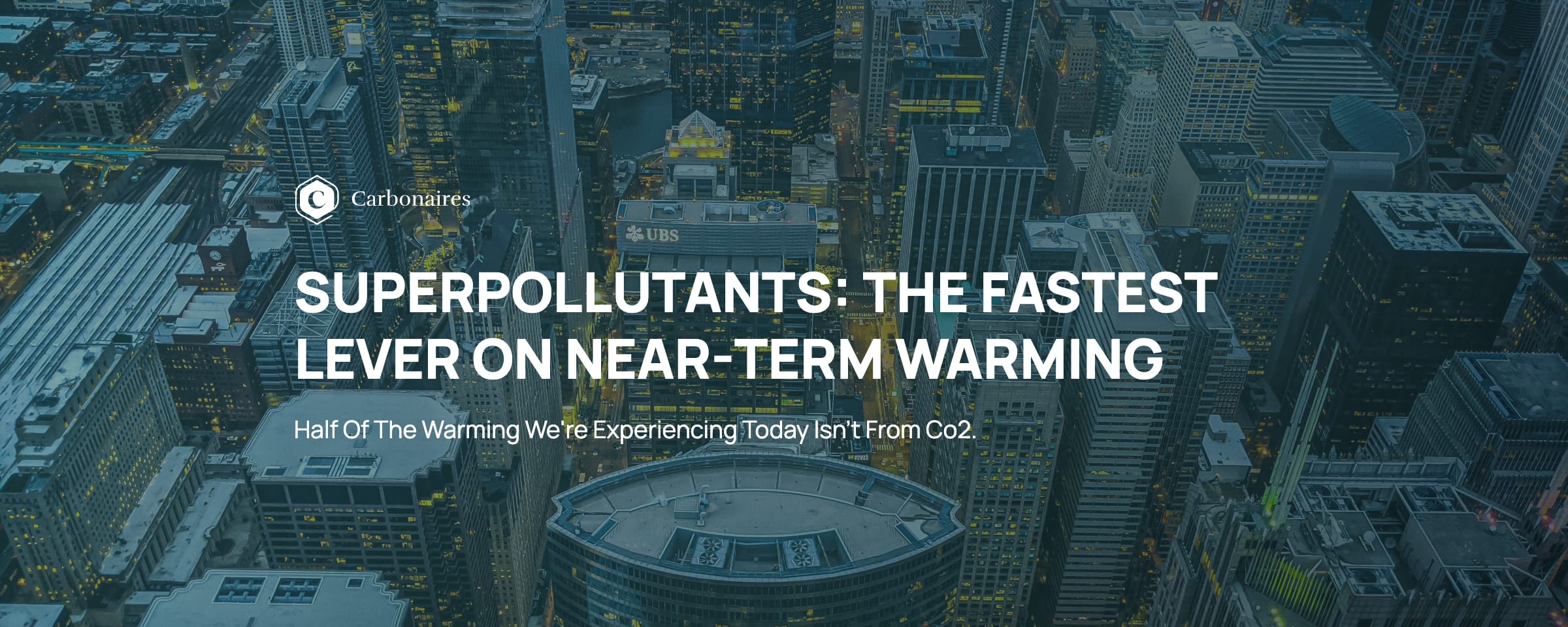 Superpollutants: the fastest lever on near-term warming — title banner over an aerial view of a city skyline at dusk